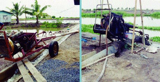 Long-tail pump being used to lift water from a Thai irrigation canal into a supply channel for freshwater prawn ponds (this type of pump can also be used to drain ponds by pumping)